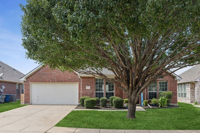 2820 Lone Ranger Trl, Little Elm, TX 75068 - view of front of house with brick siding, an attached garage, a front yard, concrete driveway, and central air condition unit