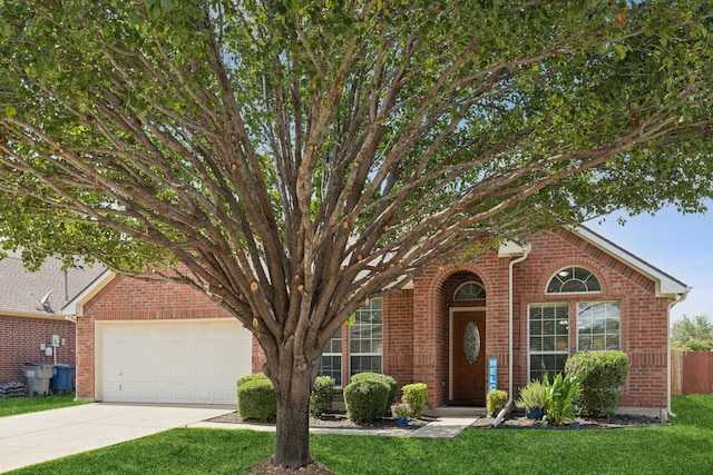 2820 Lone Ranger Trl, Little Elm, TX 75068 - view of front of property featuring concrete driveway, an attached garage, and brick siding