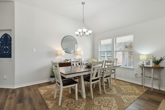 2820 Lone Ranger Trl, Little Elm, TX 75068 - dining area with a chandelier, lofted ceiling, wood finished floors, and baseboards