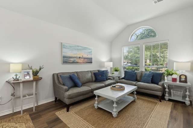 2820 Lone Ranger Trl, Little Elm, TX 75068 - living area featuring wood finished floors, vaulted ceiling, and baseboards