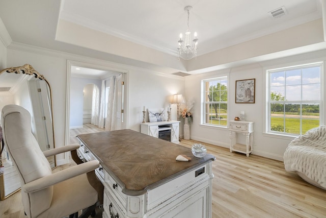 3823 Bluebonnet Trl, Princeton, TX 75407 - kitchen with a chandelier, ornamental molding, light wood finished floors, a glass covered fireplace, and a raised ceiling
