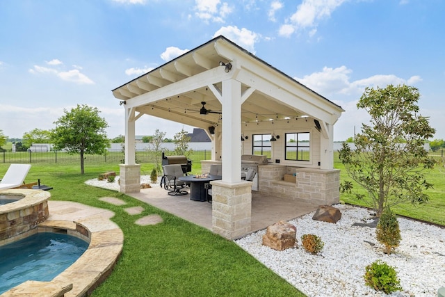 3823 Bluebonnet Trl, Princeton, TX 75407 - view of patio / terrace featuring an outdoor kitchen, ceiling fan, a gazebo, an outdoor fire pit, and an in-ground hot tub