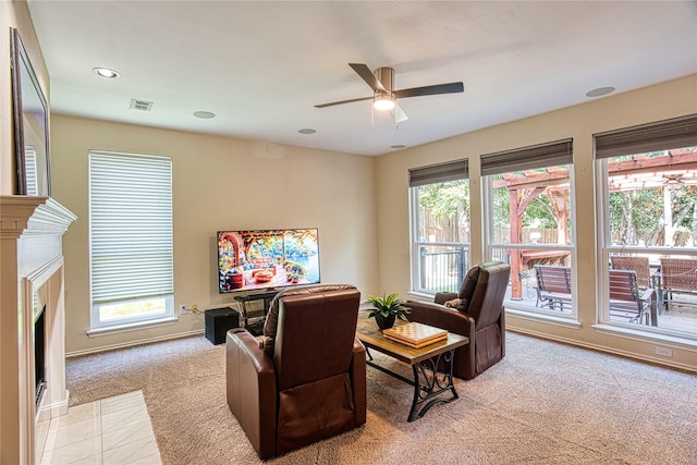 1727 Parkwood Dr, Grapevine, TX 76051 - living area with light colored carpet, plenty of natural light, a fireplace with flush hearth, ceiling fan, and recessed lighting