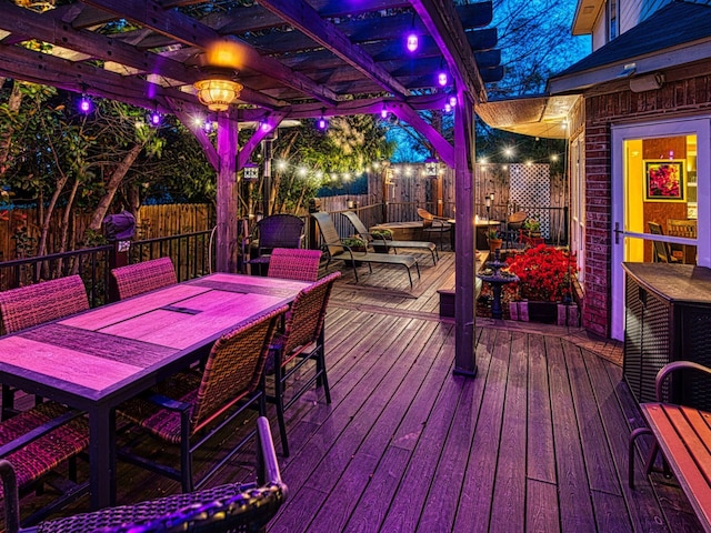 1727 Parkwood Dr, Grapevine, TX 76051 - deck at night featuring a fenced backyard, a pergola, and outdoor dining area