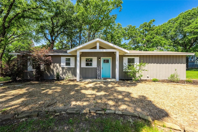 single story home with board and batten siding