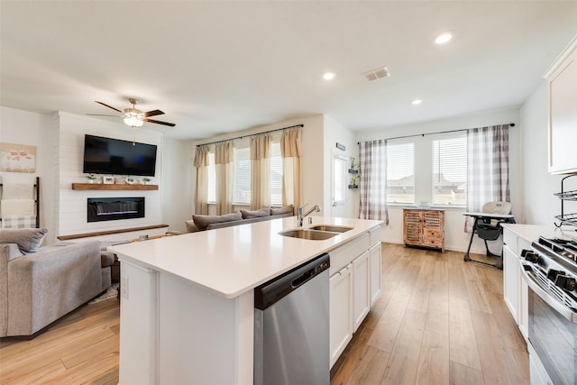 14620 Serrano Ridge Rd, Fort Worth, TX 76052 - kitchen with stainless steel appliances, a sink, open floor plan, ceiling fan, and light countertops