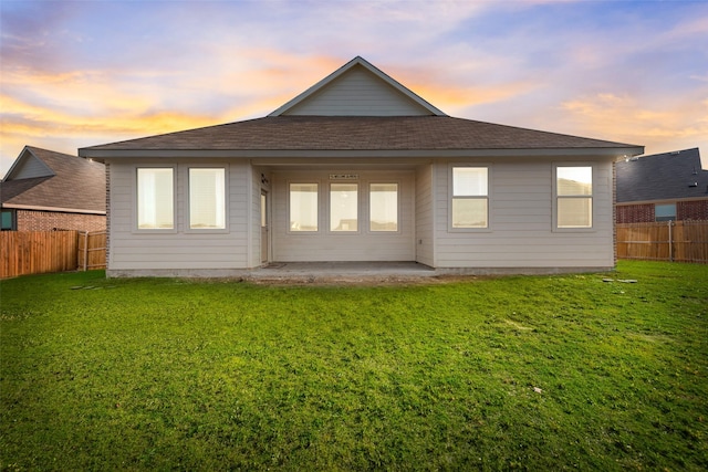 14620 Serrano Ridge Rd, Fort Worth, TX 76052 - back of house at dusk with a patio area and a shingled roof