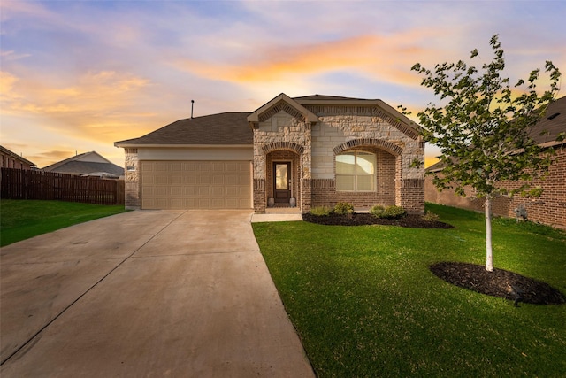 14620 Serrano Ridge Rd, Fort Worth, TX 76052 - french country style house with an attached garage, concrete driveway, stone siding, and brick siding