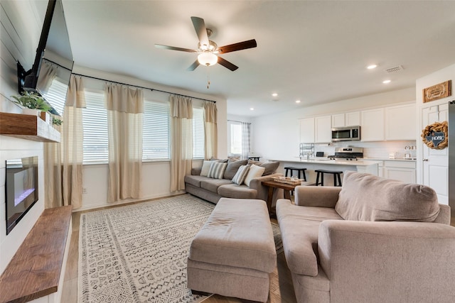14620 Serrano Ridge Rd, Fort Worth, TX 76052 - living area with ceiling fan, recessed lighting, and a glass covered fireplace