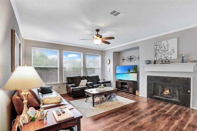 5428 Redwater Ct, The Colony, TX 75056 - living area with ornamental molding, wood finished floors, ceiling fan, a premium fireplace, and baseboards