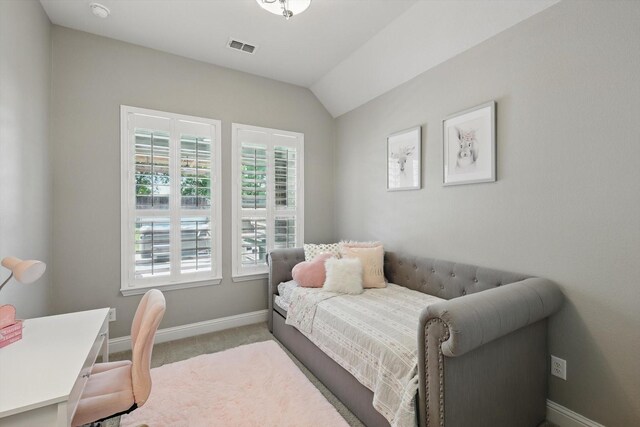 bedroom with baseboards, carpet, vaulted ceiling, and visible vents