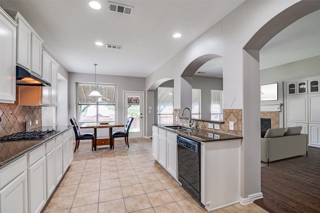 1370 Misty Cv, Rockwall, TX 75087 - kitchen featuring black dishwasher, gas cooktop, decorative backsplash, recessed lighting, and white cabinets
