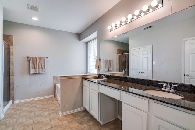 1370 Misty Cv, Rockwall, TX 75087 - bathroom with a stall shower, double vanity, a bath, and tile patterned floors
