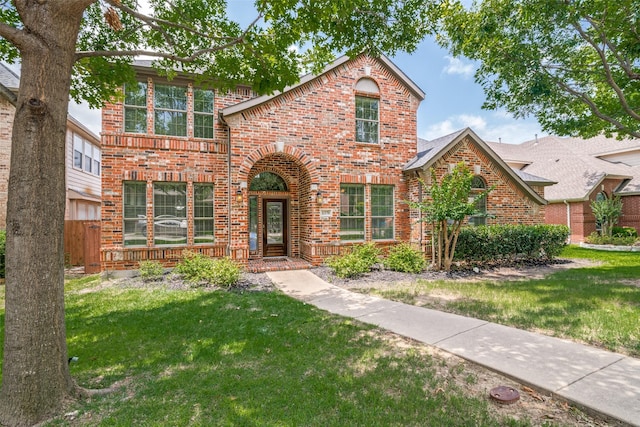 1370 Misty Cv, Rockwall, TX 75087 - traditional-style home featuring brick siding and a front yard