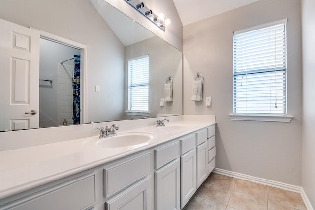 1370 Misty Cv, Rockwall, TX 75087 - bathroom with double vanity, vaulted ceiling, tile patterned floors, and a shower with curtain