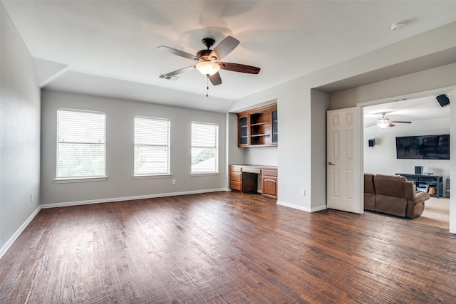 1370 Misty Cv, Rockwall, TX 75087 - unfurnished living room featuring ceiling fan, dark wood-type flooring, and a desk