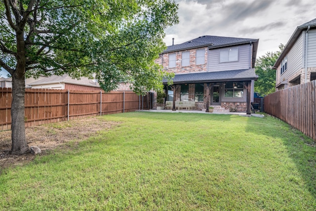 1370 Misty Cv, Rockwall, TX 75087 - rear view of house with brick siding, roof with shingles, and a fenced backyard