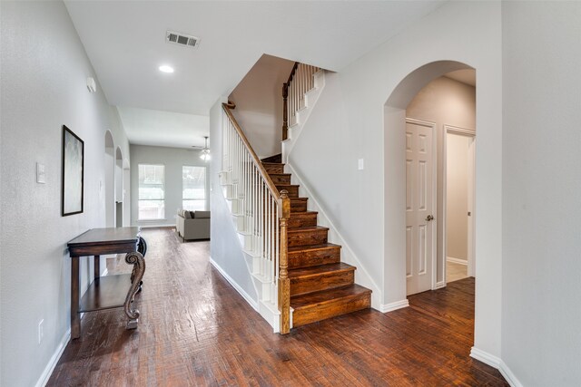 1370 Misty Cv, Rockwall, TX 75087 - staircase with wood finished floors, a ceiling fan, arched walkways, and recessed lighting