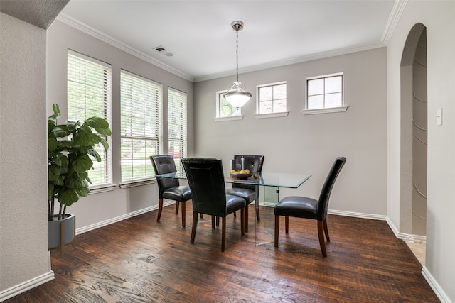 1370 Misty Cv, Rockwall, TX 75087 - dining space featuring wood finished floors, ornamental molding, and arched walkways