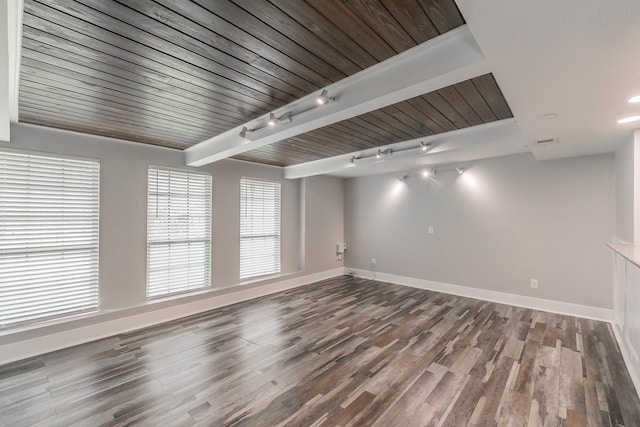 unfurnished living room with track lighting, baseboards, wood finished floors, and visible vents