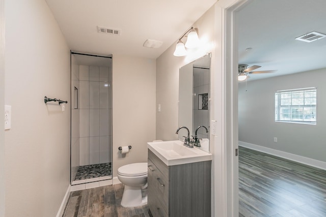 bathroom featuring wood finished floors, visible vents, a ceiling fan, and toilet