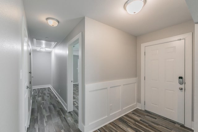 interior space featuring wainscoting and dark wood-style flooring