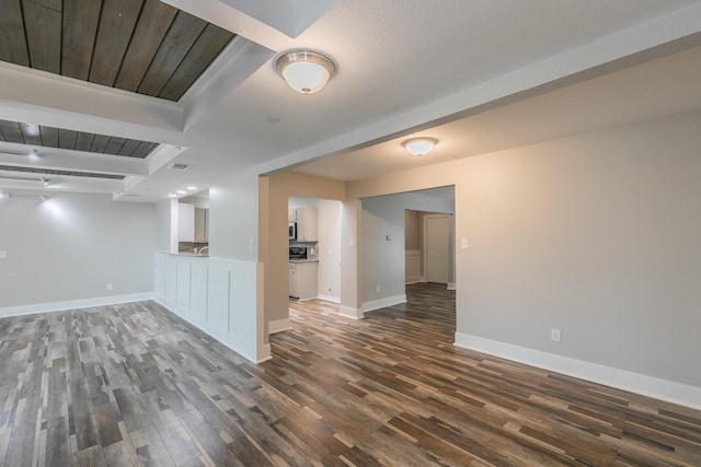 interior space with wood finished floors and baseboards
