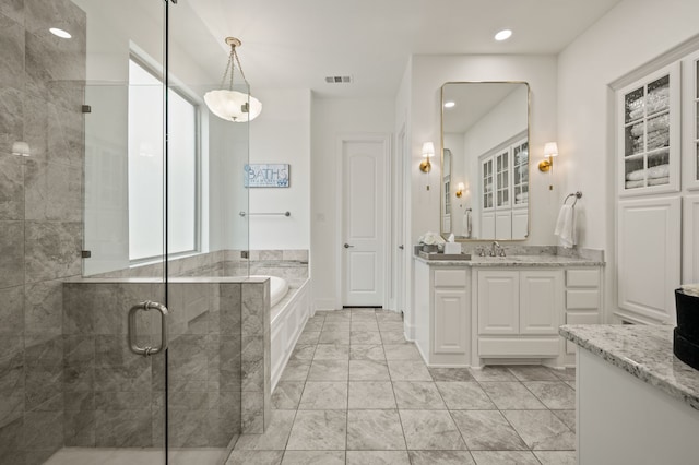 bathroom featuring a shower stall, marble finish floor, visible vents, vanity, and a garden tub