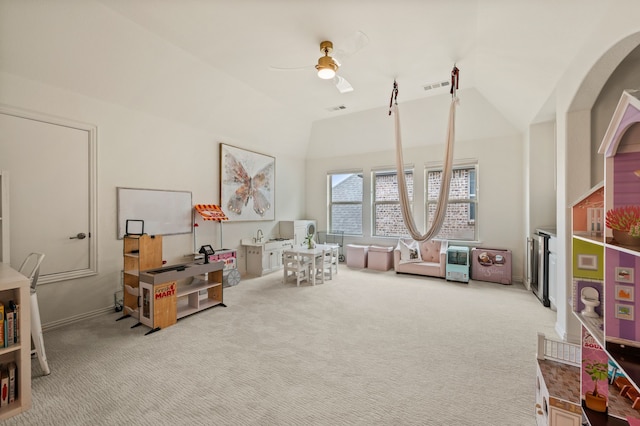 rec room with lofted ceiling, a ceiling fan, visible vents, and carpet floors