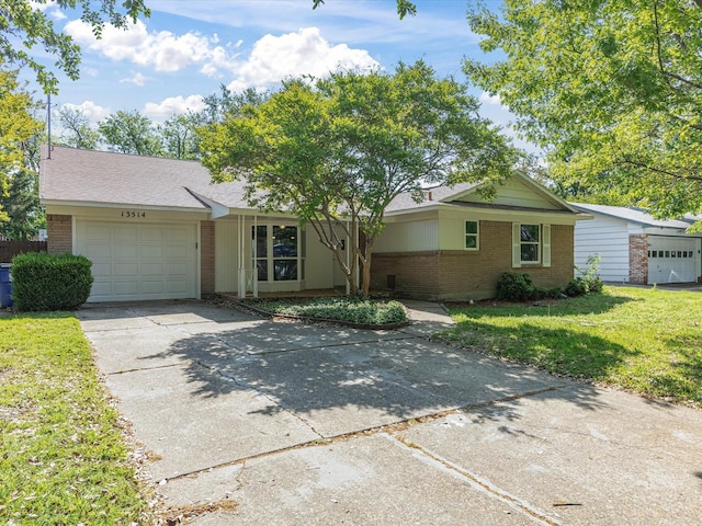 13514 Onyx Ln, Farmers Branch, TX 75234 - ranch-style house featuring a front lawn, brick siding, driveway, and a garage