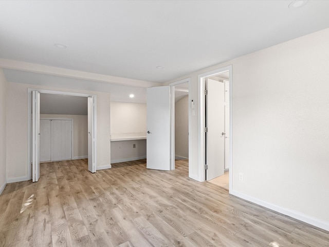 13514 Onyx Ln, Farmers Branch, TX 75234 - unfurnished bedroom with baseboards, recessed lighting, and light wood-style floors