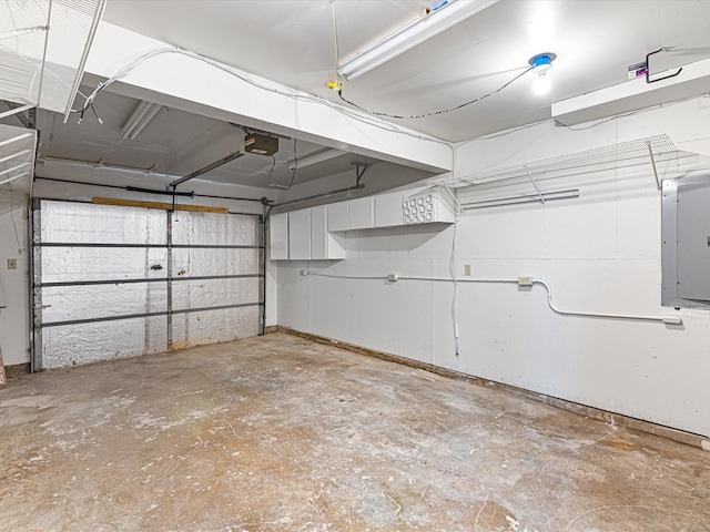 13514 Onyx Ln, Farmers Branch, TX 75234 - garage featuring a garage door opener and electric panel