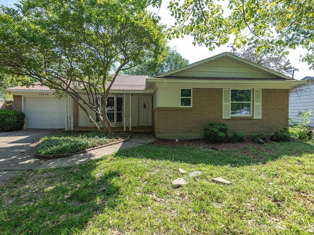 13514 Onyx Ln, Farmers Branch, TX 75234 - single story home featuring an attached garage, a front lawn, driveway, and brick siding