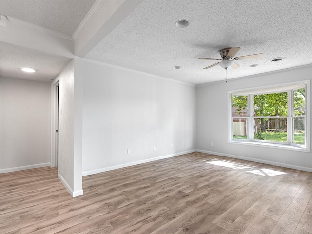 13514 Onyx Ln, Farmers Branch, TX 75234 - empty room featuring a ceiling fan, wood finished floors, a textured ceiling, and ornamental molding