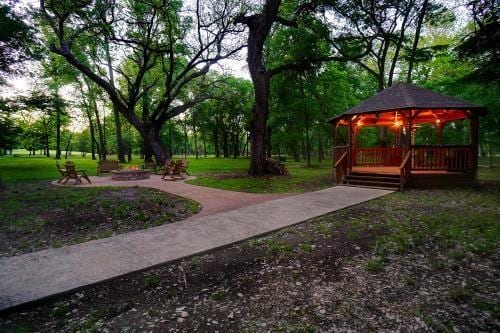 7200 Oak Creeks Ct, Fort Worth, TX 76135 - birds eye view of property featuring a view of trees