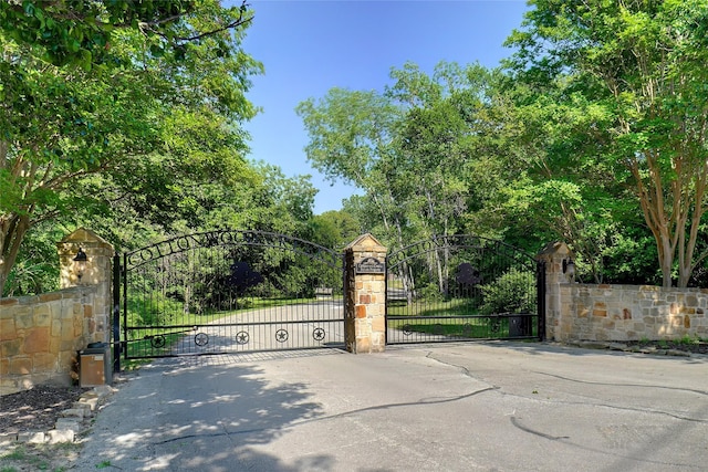 7200 Oak Creeks Ct, Fort Worth, TX 76135 - craftsman inspired home with a front lawn, stone siding, brick siding, a porch, and a chimney