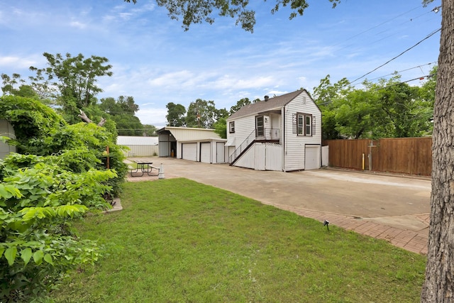 exterior space with fence, an outdoor structure, and stairs
