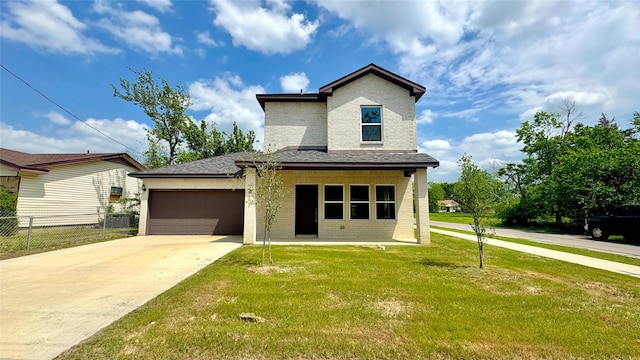 view of front of house with fence, an attached garage, brick siding, and a front yard