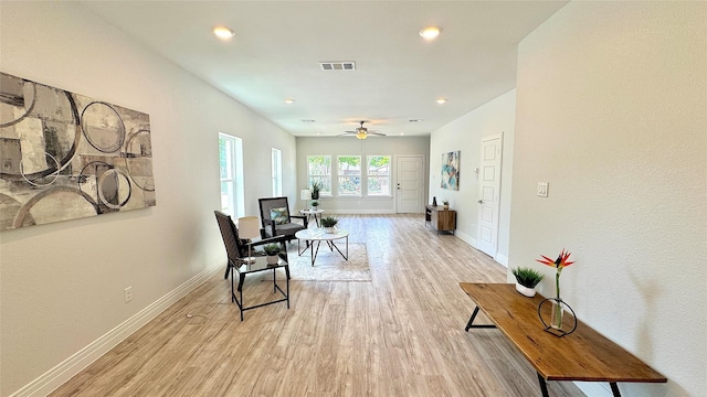 sitting room with recessed lighting, visible vents, light wood-style floors, baseboards, and ceiling fan