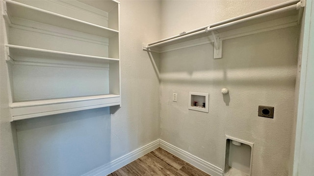 laundry area featuring hookup for an electric dryer, baseboards, hookup for a washing machine, wood finished floors, and gas dryer hookup