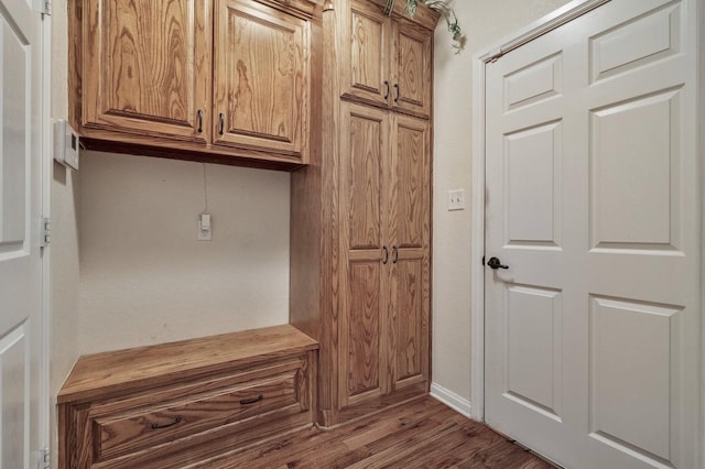 mudroom with baseboards and wood finished floors