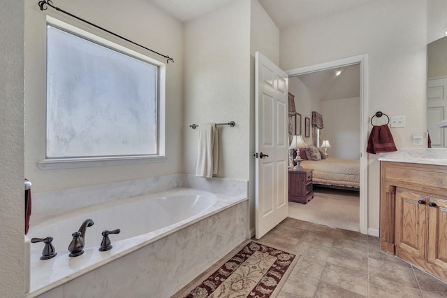 full bathroom featuring a bath, ensuite bathroom, and vanity
