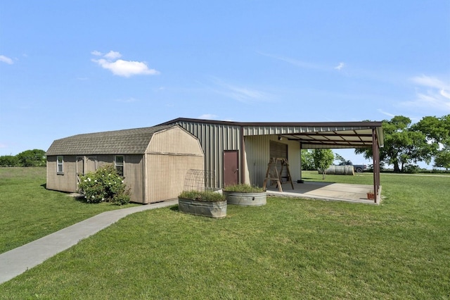 exterior space featuring an outdoor structure and a front lawn