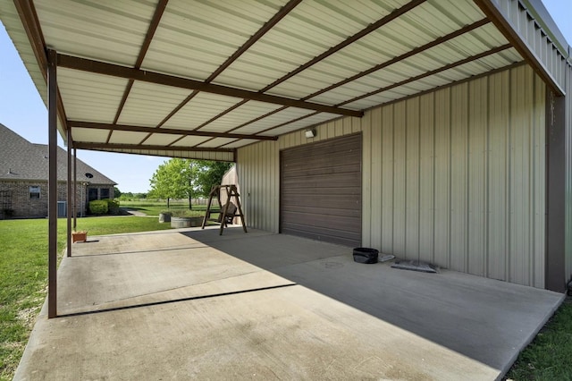 view of patio with a detached garage