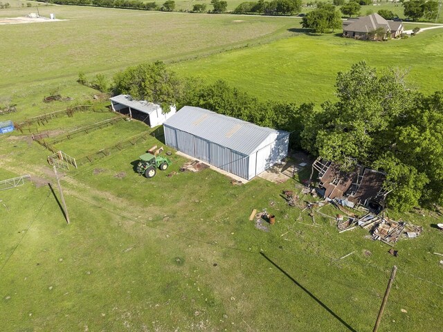 birds eye view of property with a rural view