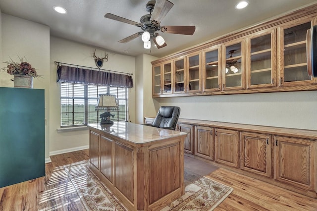 home office featuring a ceiling fan, baseboards, recessed lighting, and light wood-style floors