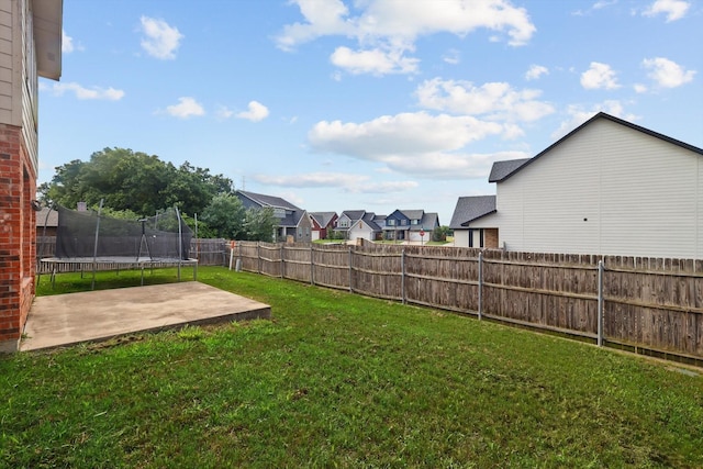 7308 Circle Dr, North Richland Hills, TX 76180 - view of yard with a trampoline, a patio area, and a residential view