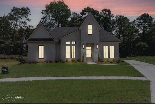 831 Walstonburg Ln, Benton, LA 71006 - modern farmhouse style home featuring a front yard, roof with shingles, and driveway