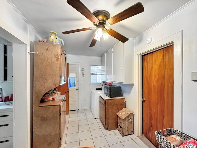 kitchen featuring light countertops, ornamental molding, light tile patterned floors, black microwave, and ceiling fan