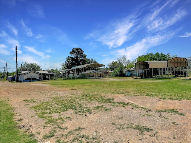view of yard featuring a detached carport